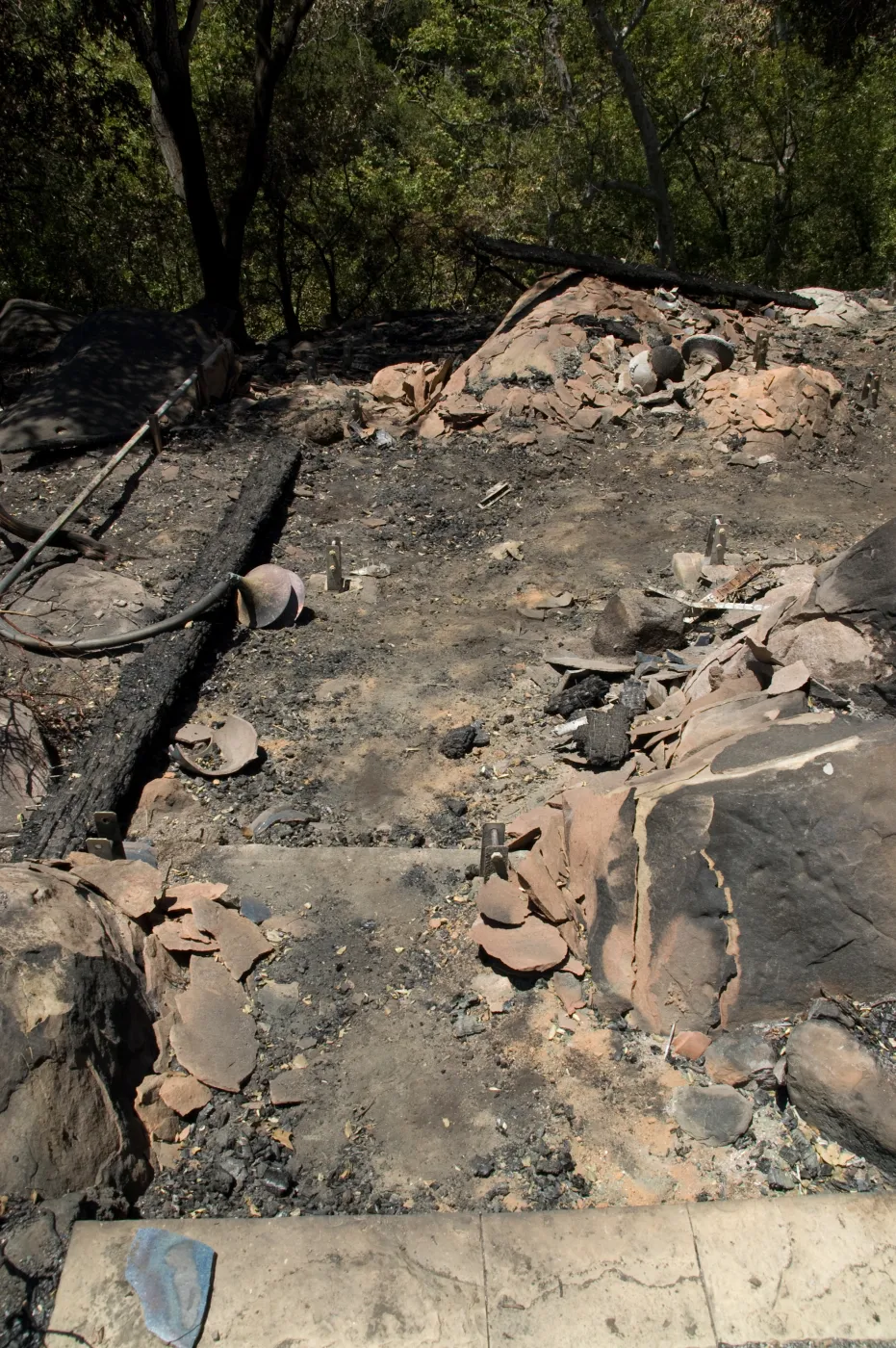 burned wood deck along canyon rim, adjacent to cottage, after the Jesusita Fire