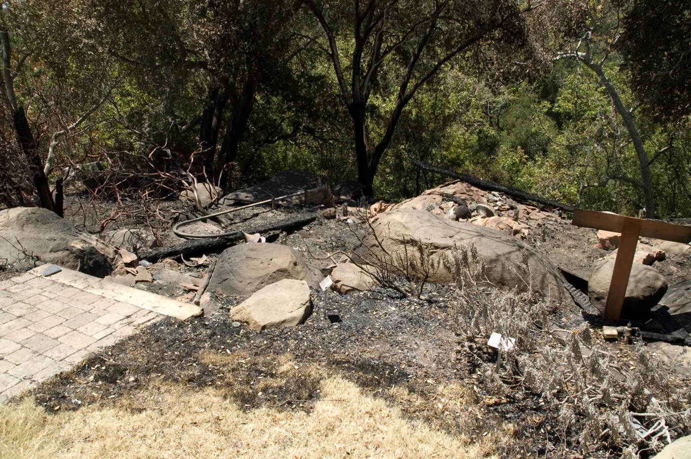 burned wood deck along canyon rim, adjacent to cottage, after the Jesusita Fire