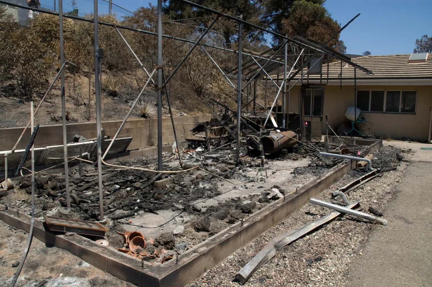 burned lath house with Hort unit building behind, after the Jesusita Fire