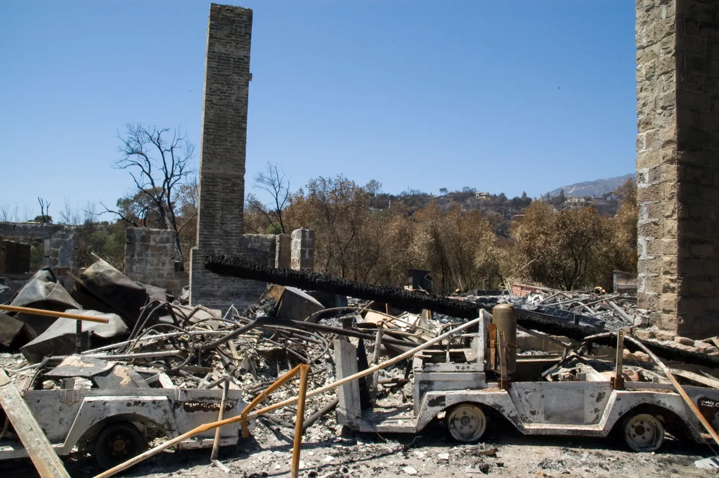 burned vehicles at the Gane House site, after the Jesusita Fire