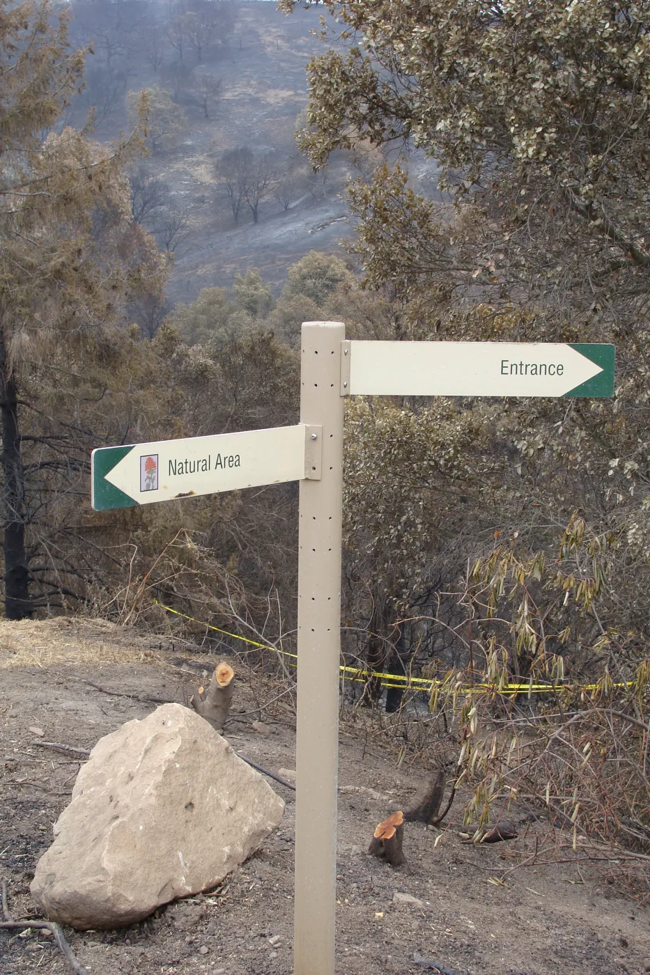 Directional sign and burned vegetation on the East Slope, after the Jesusita Fire