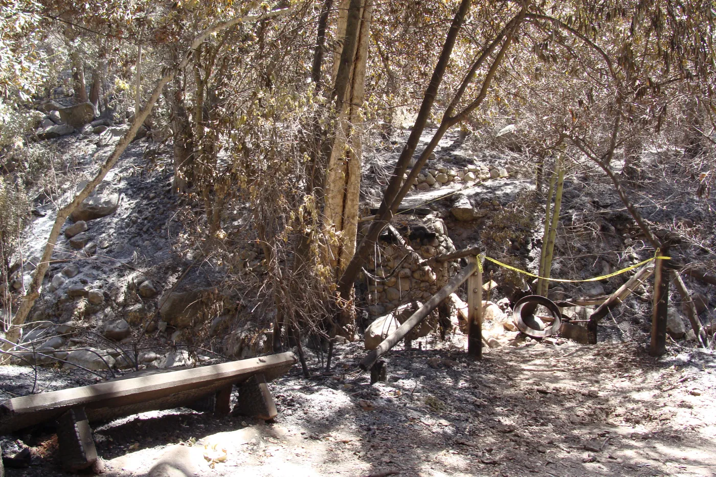 burned wood bench and remains of the Campbell Bridge, after the Jesusita Fire