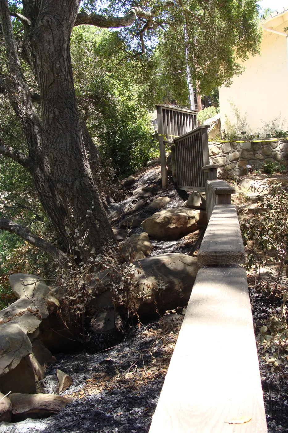 wood railing on the west side of the Cottage, after the Jesusita Fire
