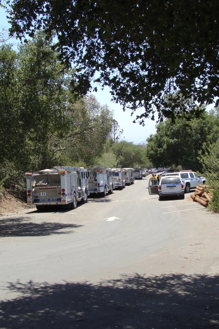 Parking lot with Santa Barbara fire vehicles and firefighters at the Santa Barbara Botanic Garden, after the Jesusita Fire
