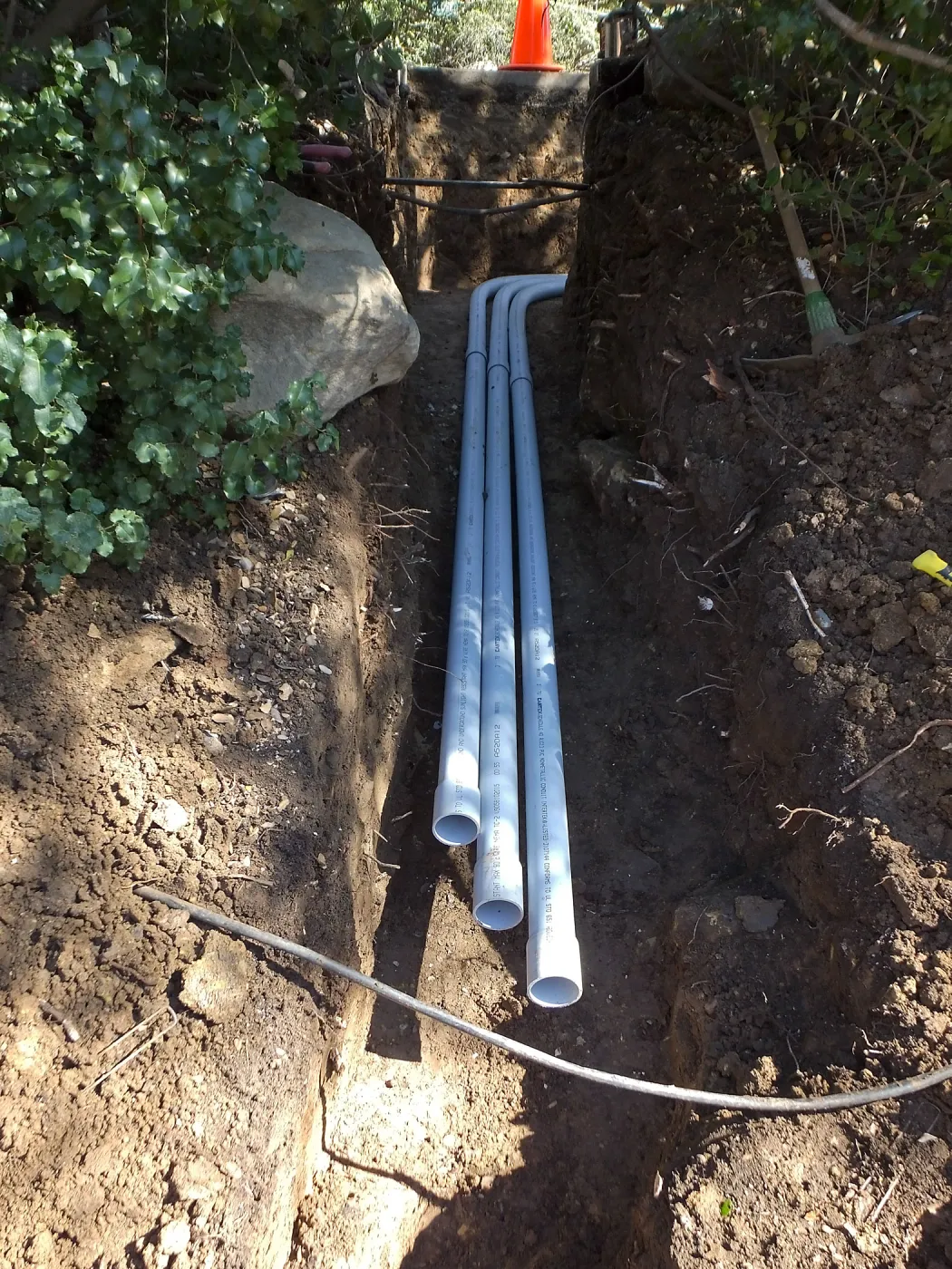 Power and data conduit being installed in the Arroyo Section