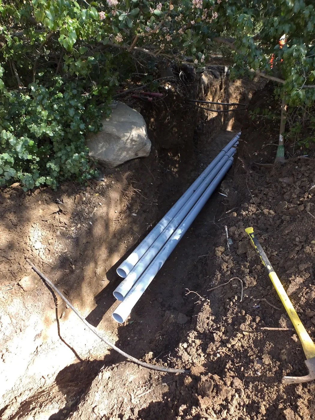 Power and data conduit being installed in the Arroyo Section