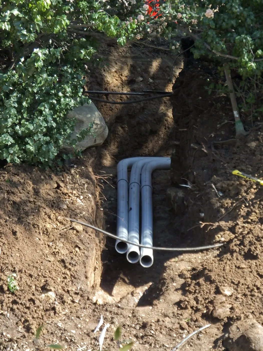 Power and data conduit being installed in the Arroyo Section
