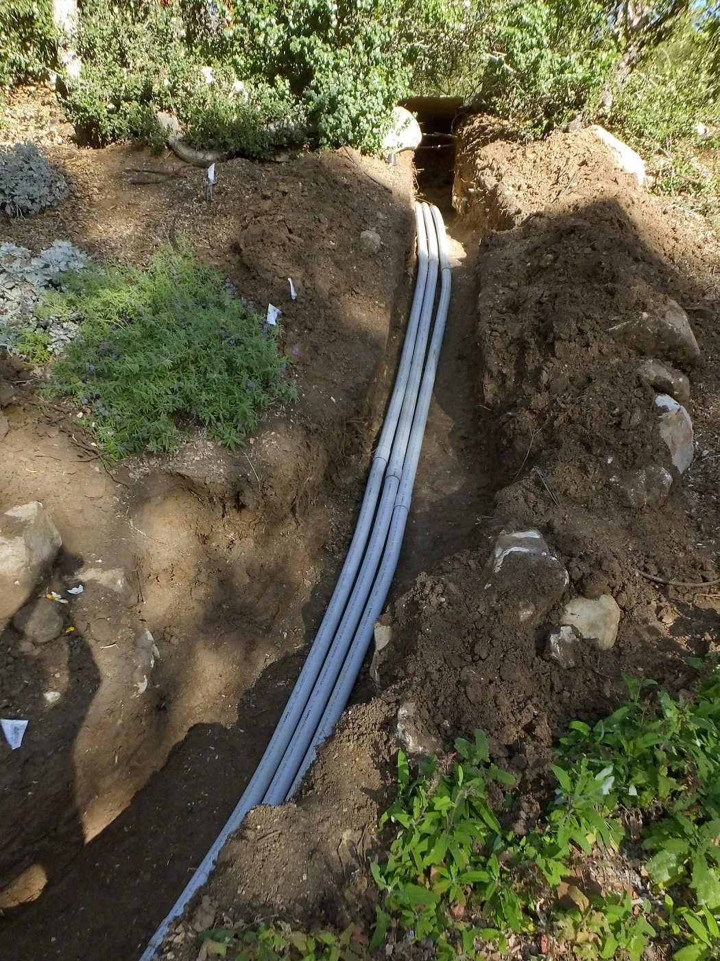 Power and data conduit being installed in the Arroyo Section