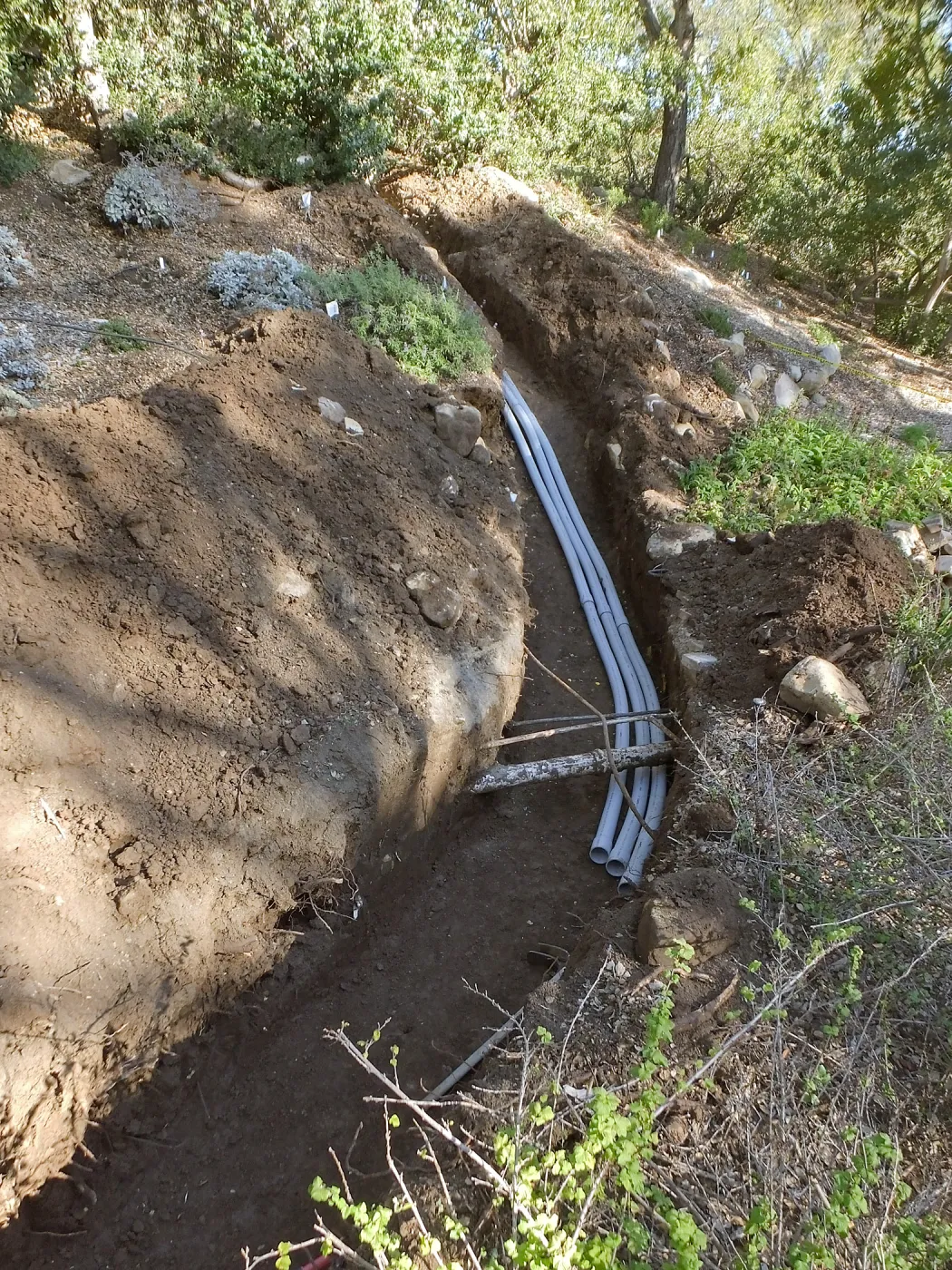 Power and data conduit being installed in the Arroyo Section