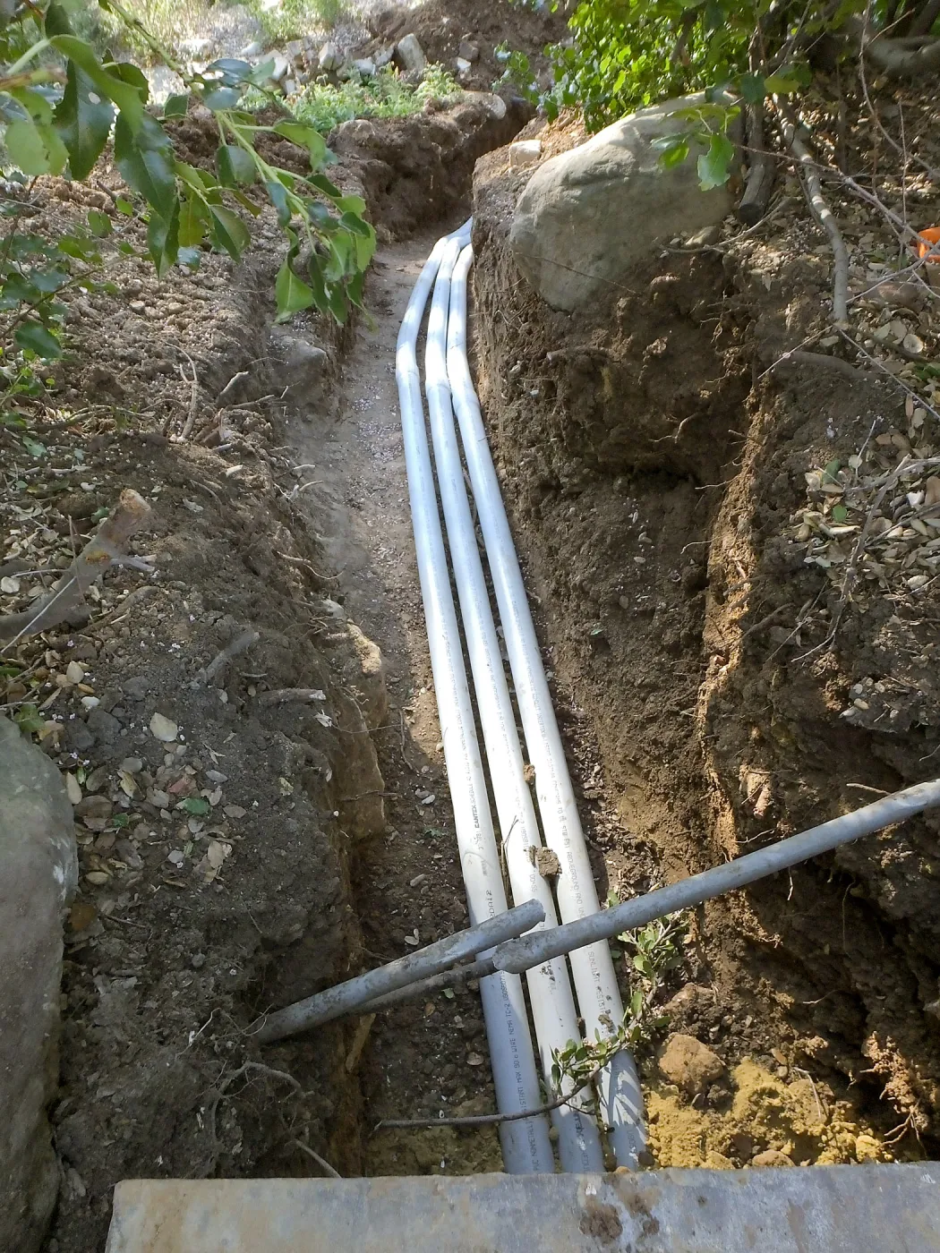 Power and data conduit being installed in the Arroyo Section