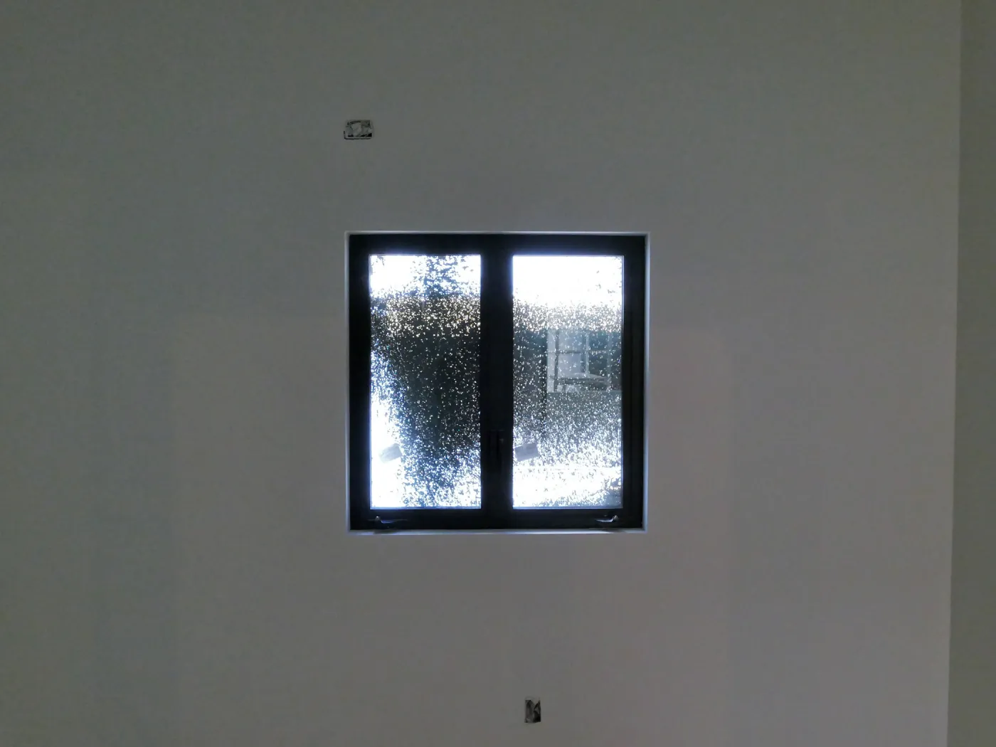 Pritzlaff Conservation Center Construction, stucco overspray patterns outside windows