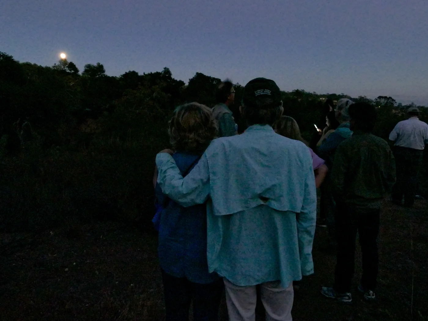 Member Appreciation Month, Full Moon Hike, hikers observing the sky at top of Pritchett Trail