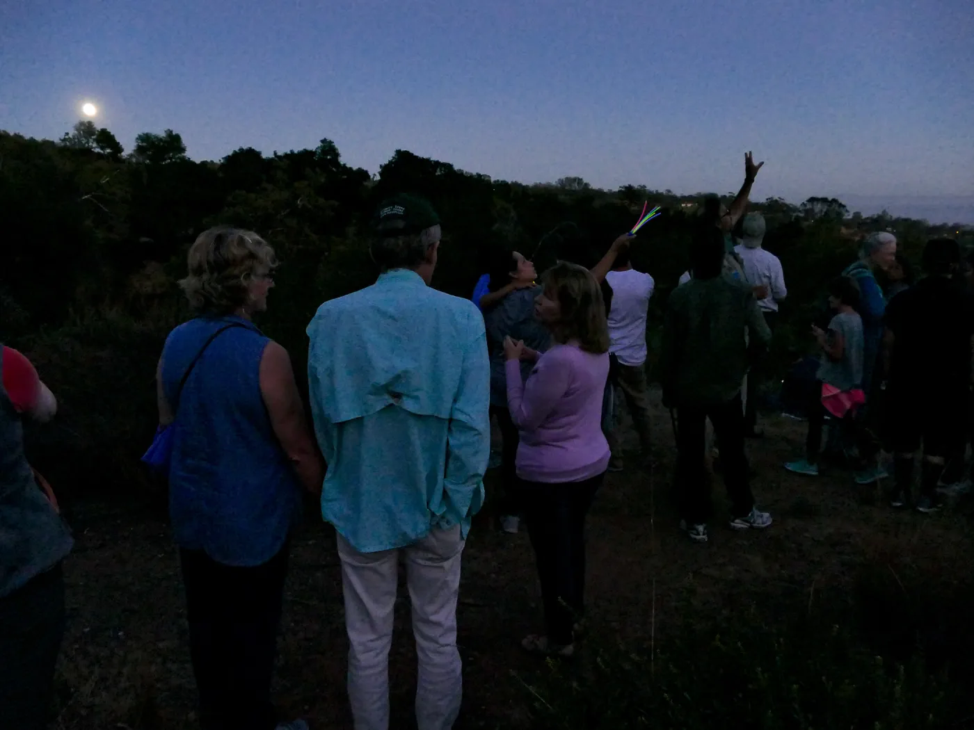 Member Appreciation Month, Full Moon Hike, hikers observing the sky at top of Pritchett Trail