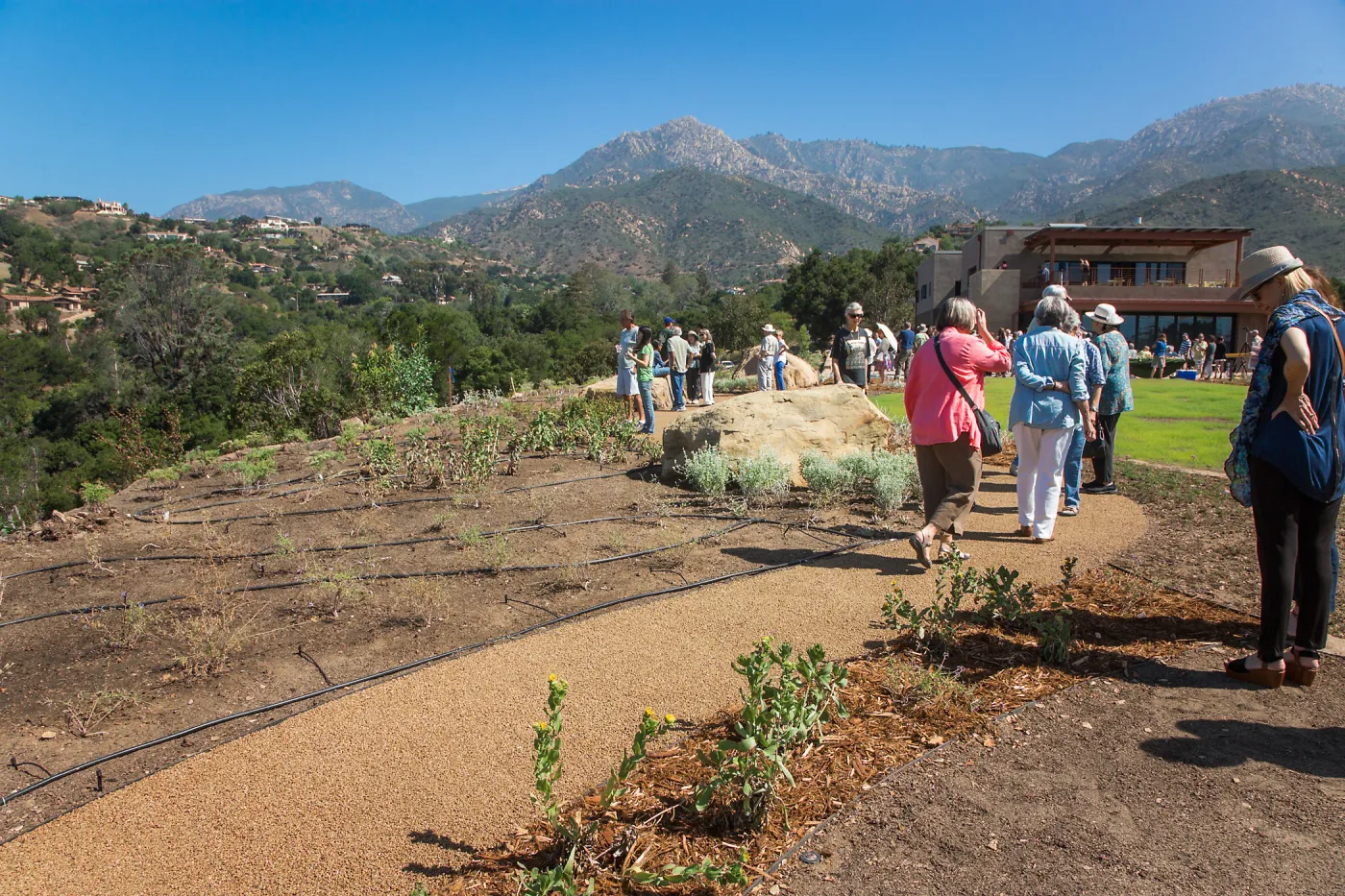 Pritzlaff Conservation Center Ribbon Cutting Celebration, guests exploring the newly planted Island View Garden