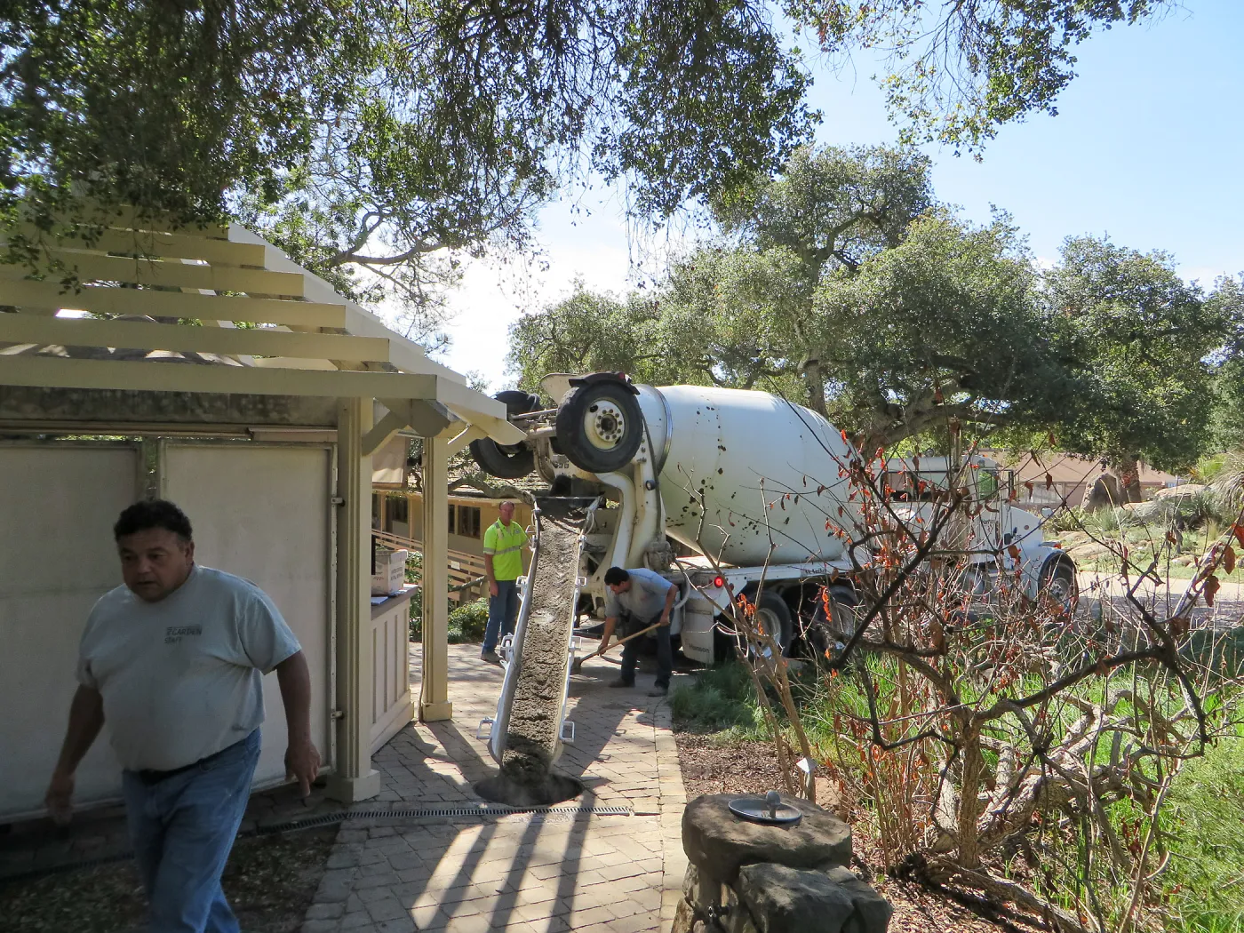 Filling septic tank at entrance with cement slurry
