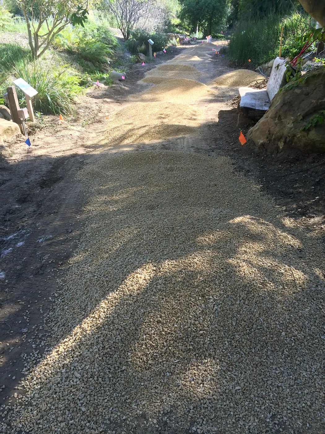 Spreading California gold gravel in Arroyo