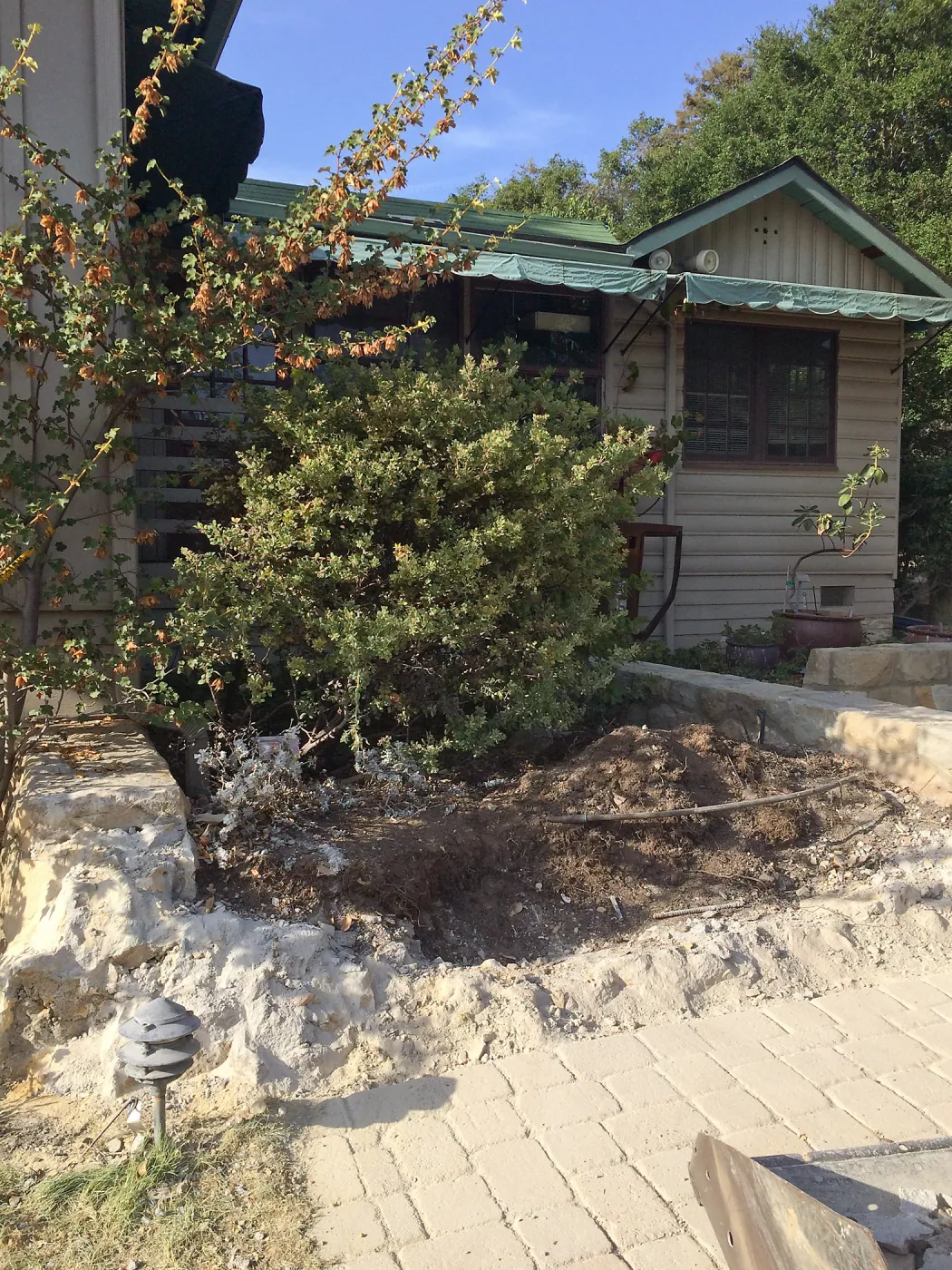 Demolition of seat wall at Home Demo Garden