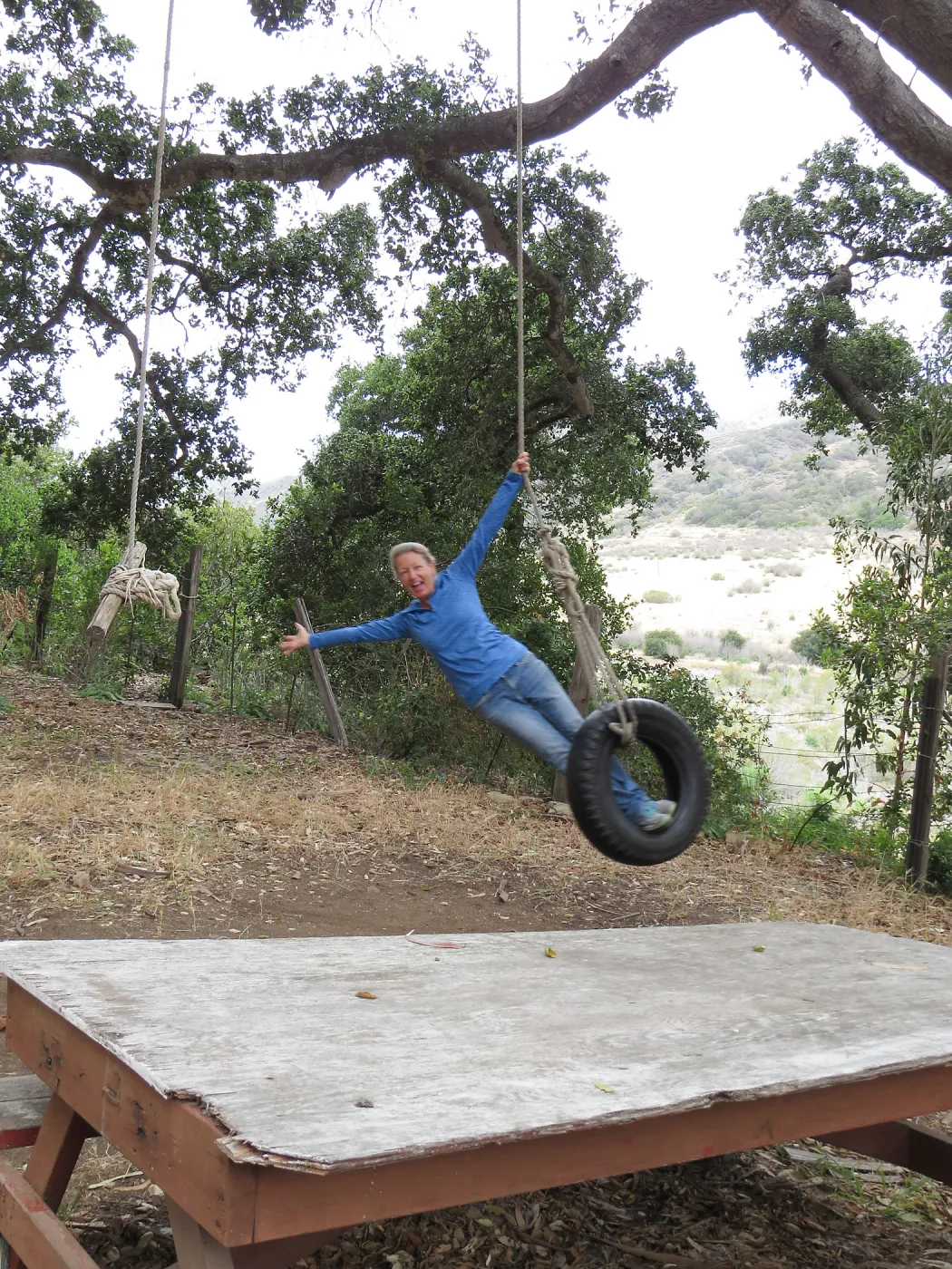 Santa Cruz Island Trip, Diana Blanchard swinging on tire swing at UC Research Station