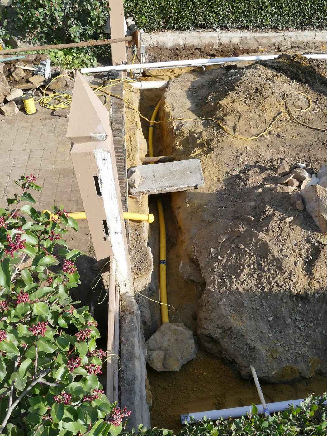 Courtyard renovation, rerouting piping, north edge looking east