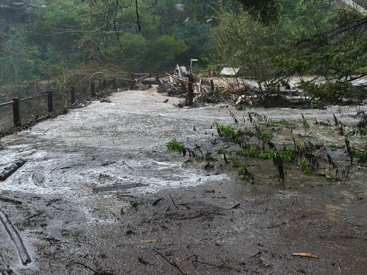 Debris accumulation at Mission Dam during rainstorm