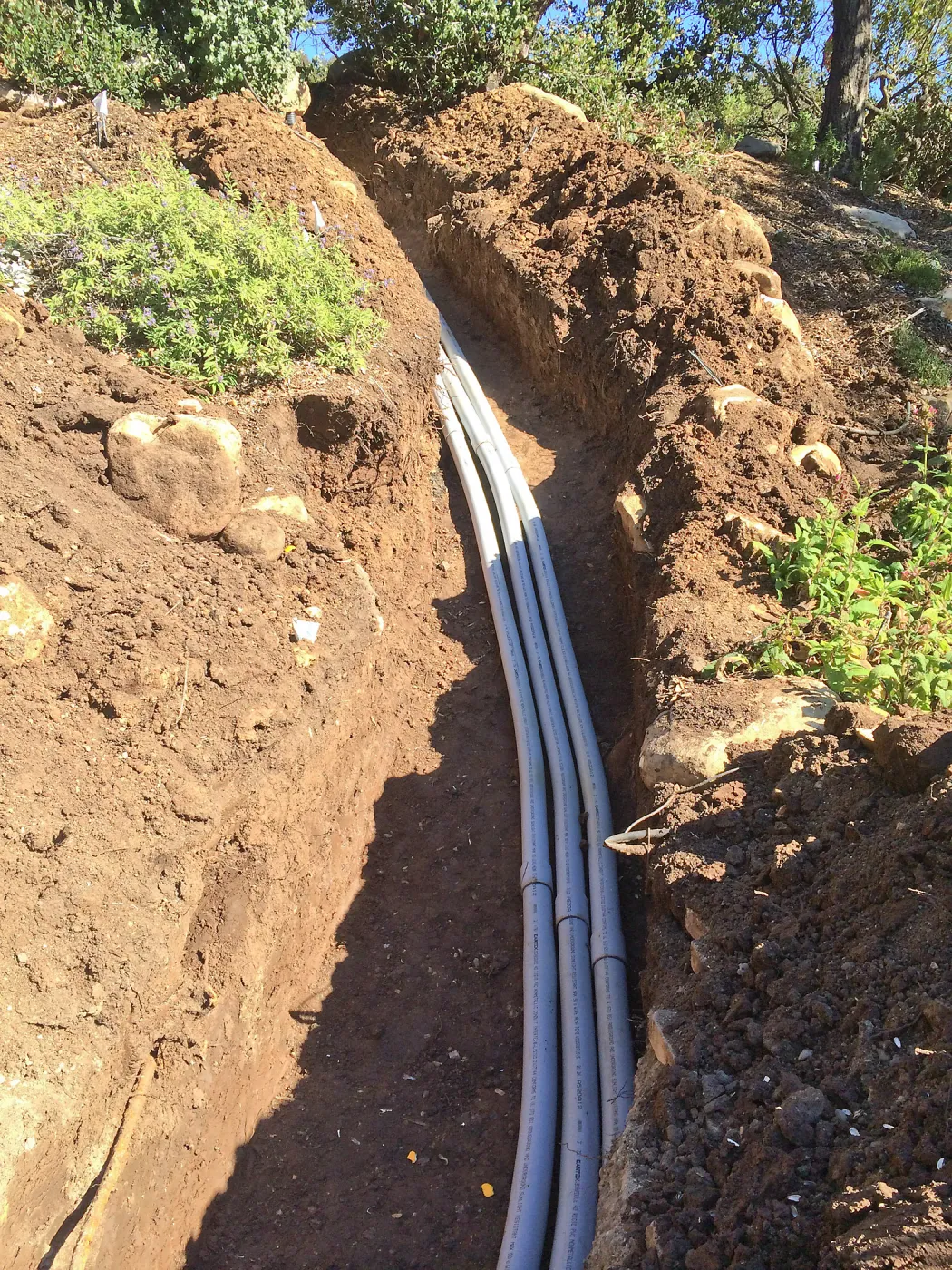 Power and data conduit being installed in the Arroyo Section