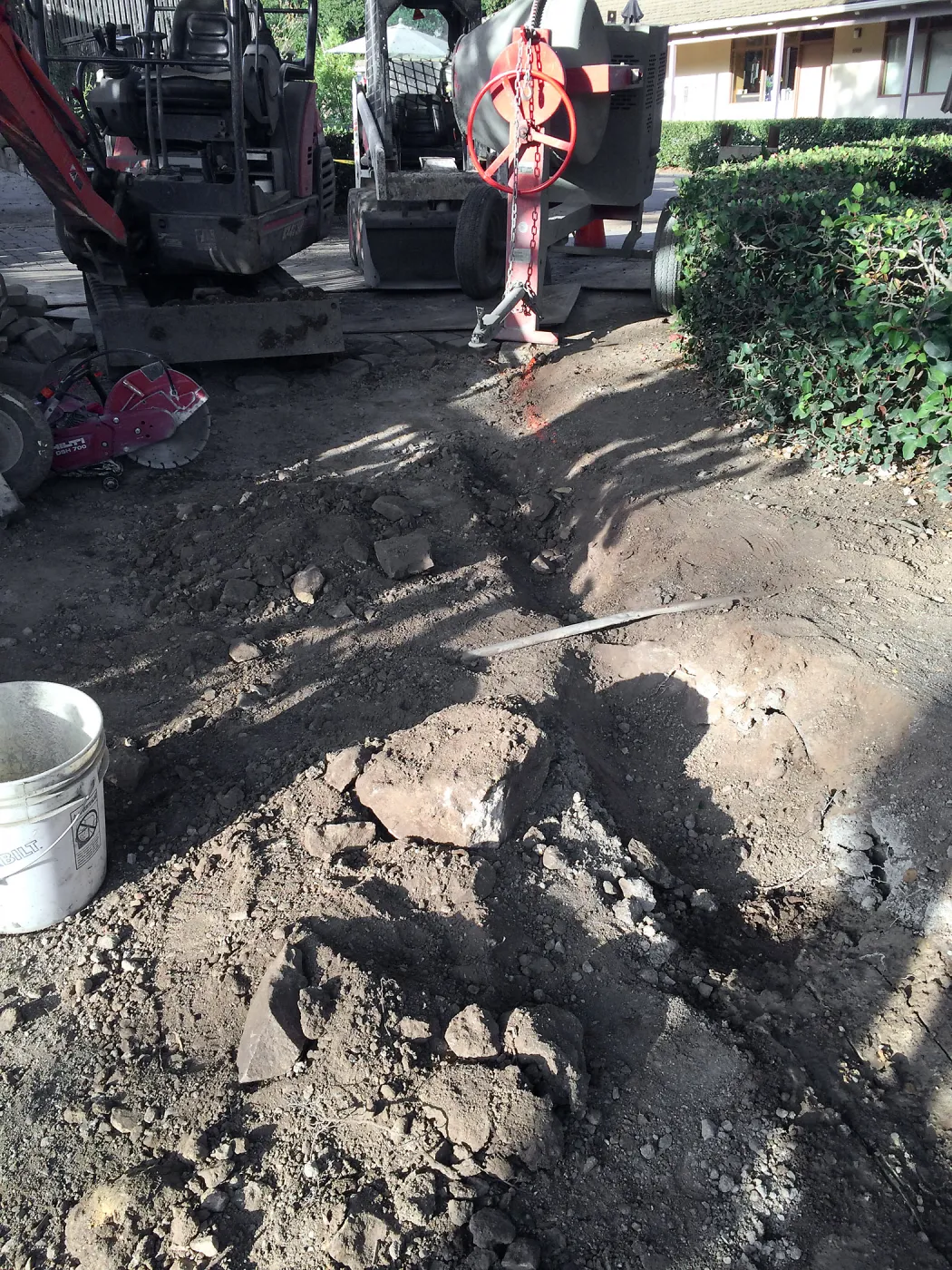 Removal of subsurface boulder in path to Water Wise Home Garden