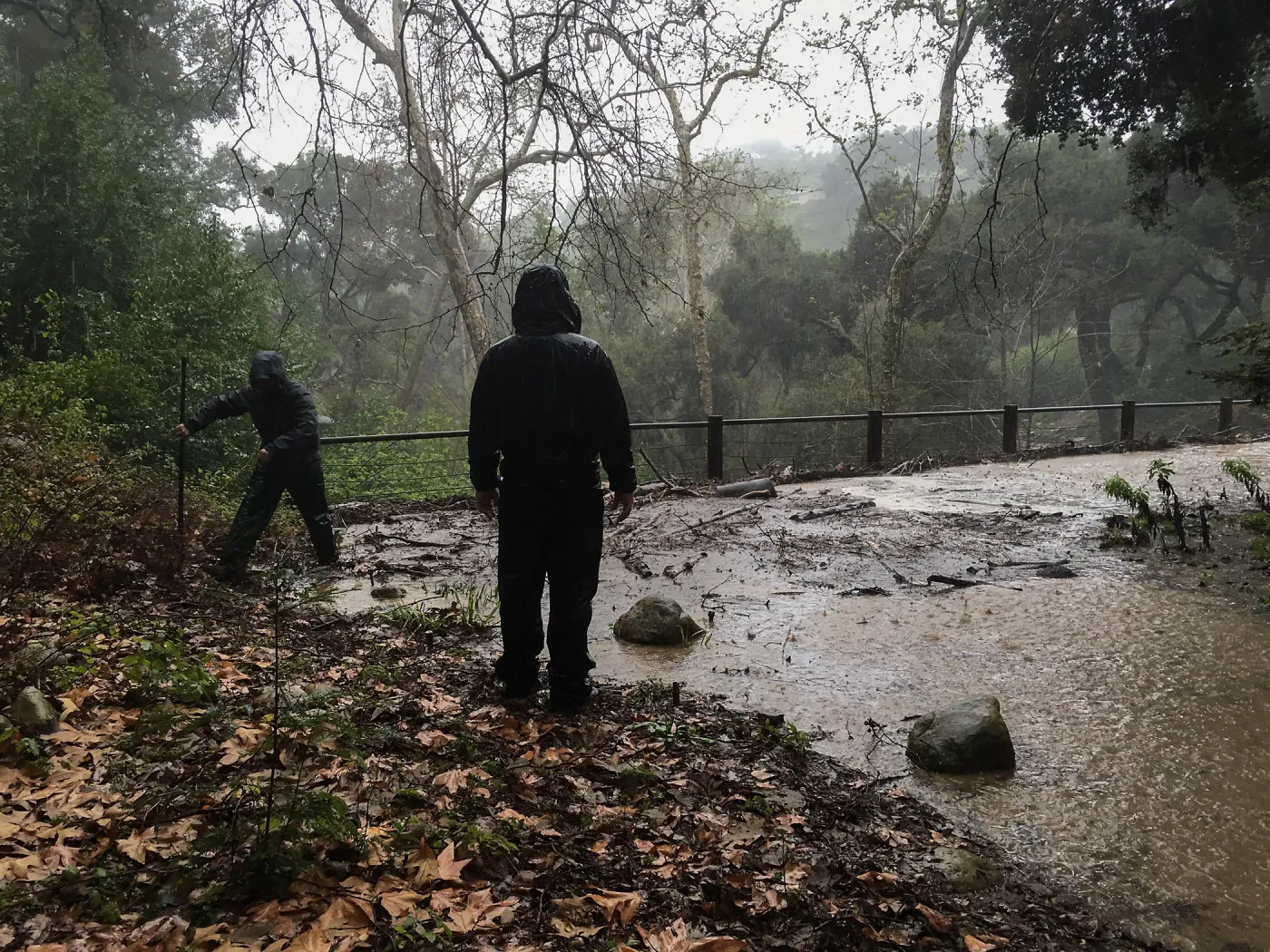 Debris accumulation at Mission Dam during rainstorm
