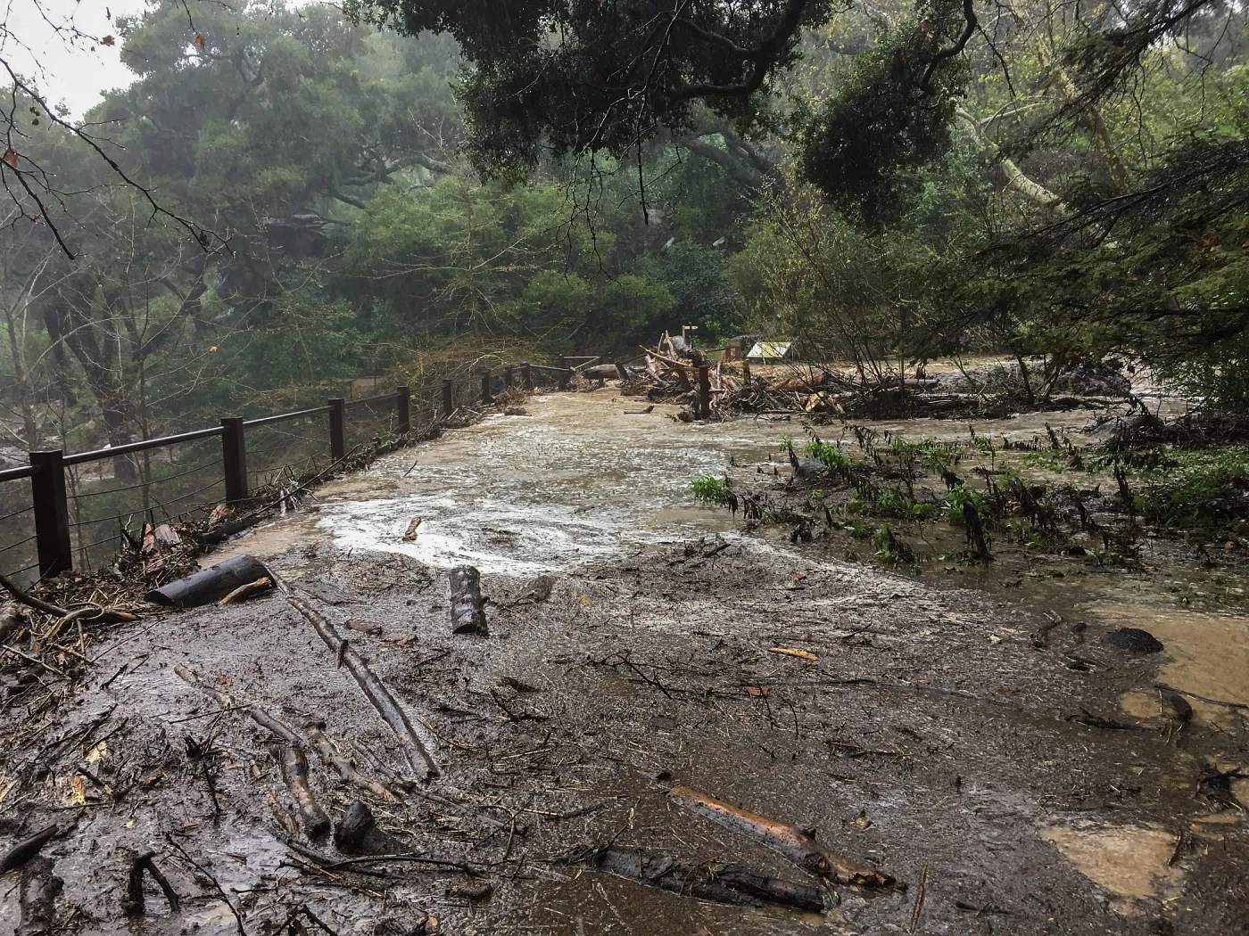 Debris accumulation at Mission Dam during rainstorm