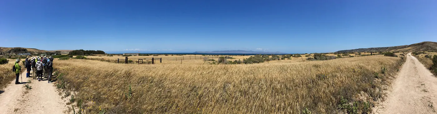 Santa Rosa Island Trip, Group hiking along Coastal Road looking towards airstrip and Santa Cruz Island