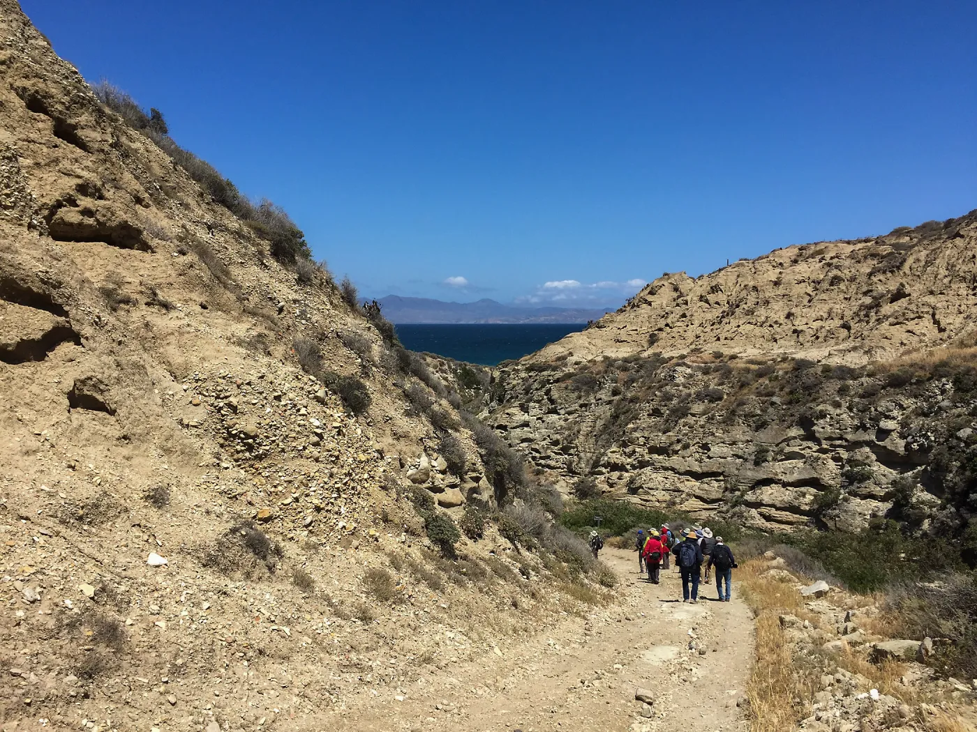 Santa Rosa Island Trip, Group hiking along Coastal Road looking towards airstrip and Santa Cruz Island