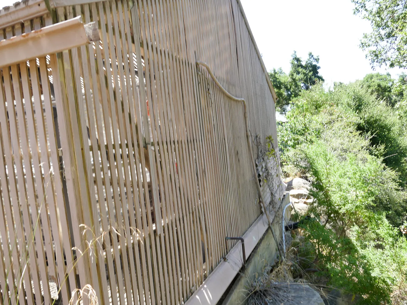 Garden Growers Lath House before start of repairs. Looking south across west wall exterior.
