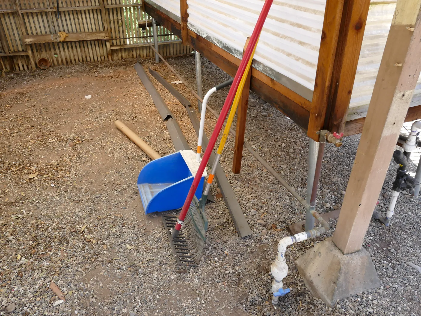 Garden Growers Lath House before start of repairs, water supply line interior shutoff valve (plastic in foreground)