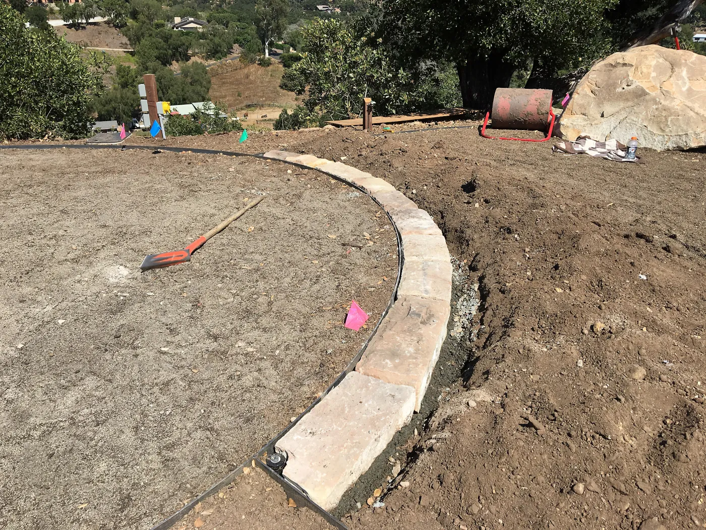 Construction of stone edging in Island View Garden lawn