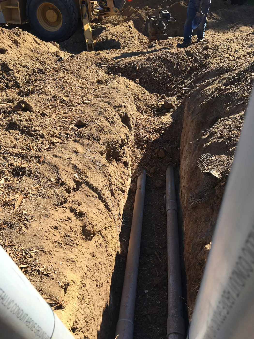 Putting in new electrical line to Horticulture Head House