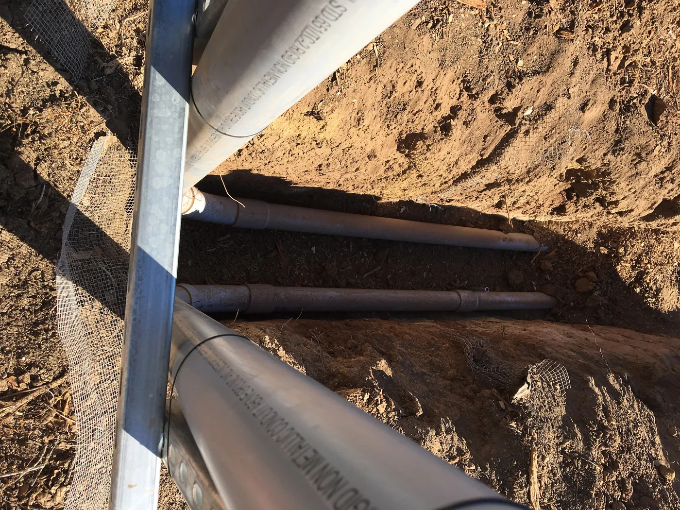 Putting in new electrical line to Horticulture Head House