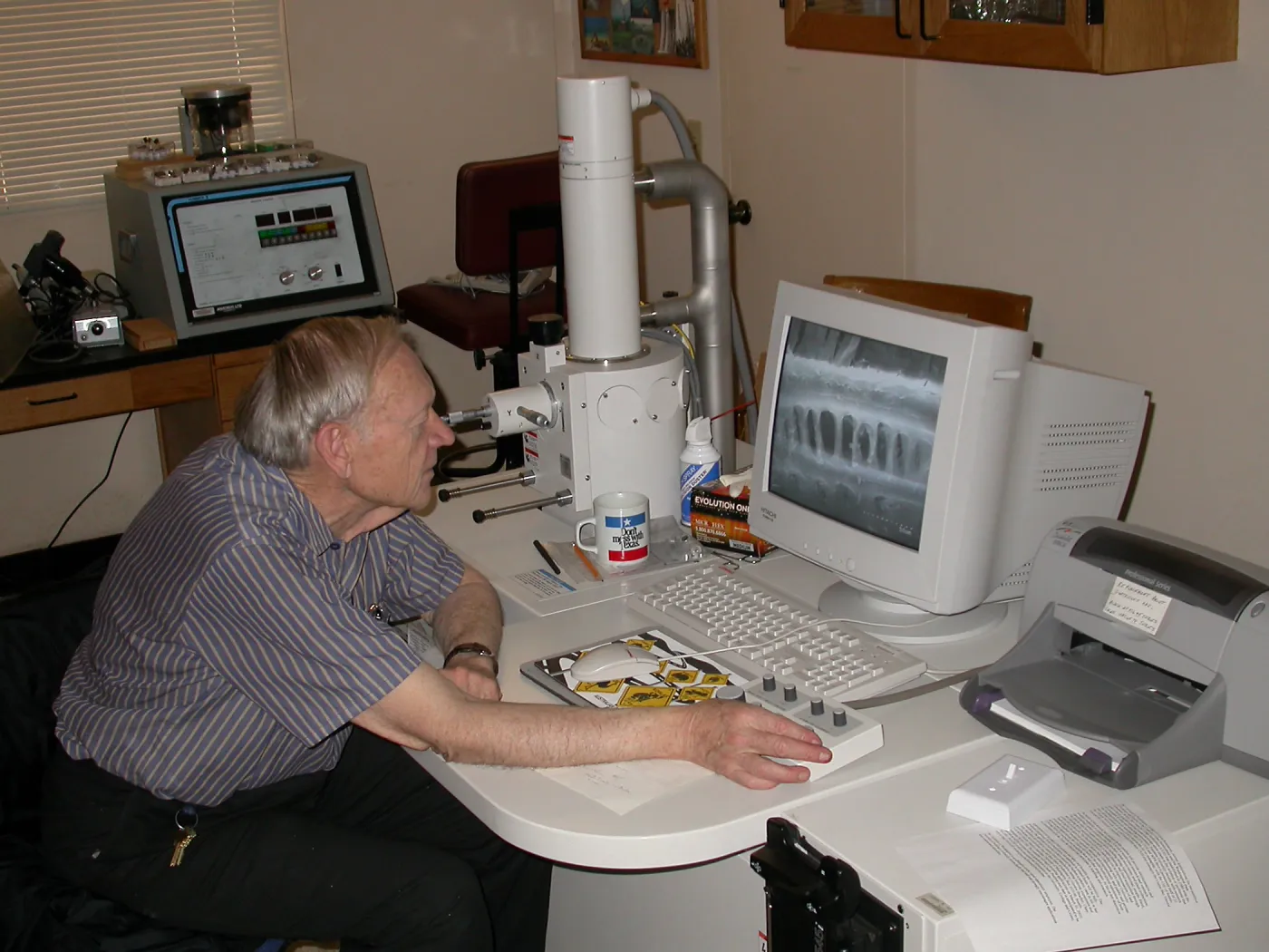 Sherwin Carlson at work with the scanning electron microscope