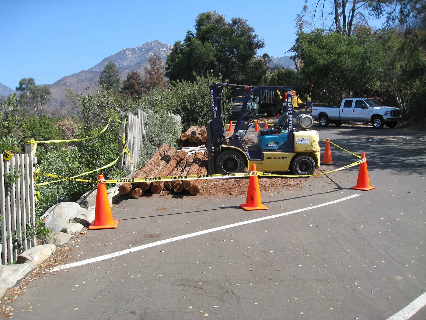 Construction of Herb Parker's â€˜Haven' labyrinth, redwood logs from Restoration Forest Project in main parking lot