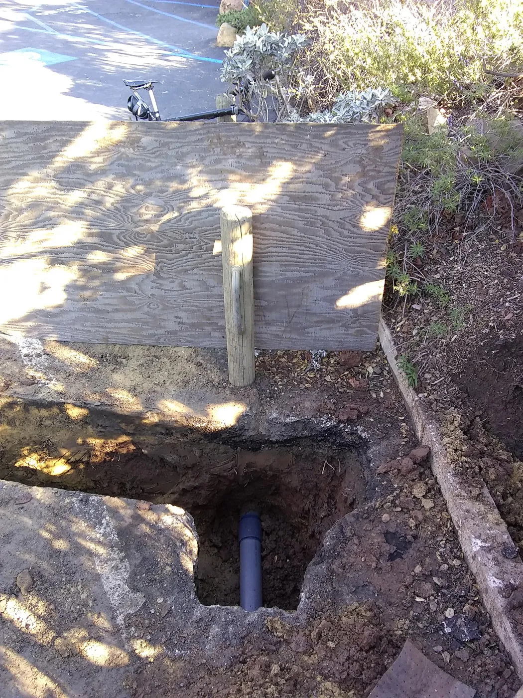 Irrigation water line repair in main parking lot, just south of the bike rack, looking north