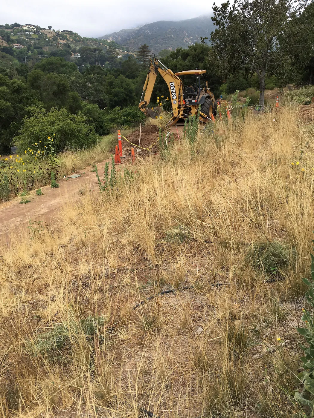 Fixing leaking water line on west PCC slope