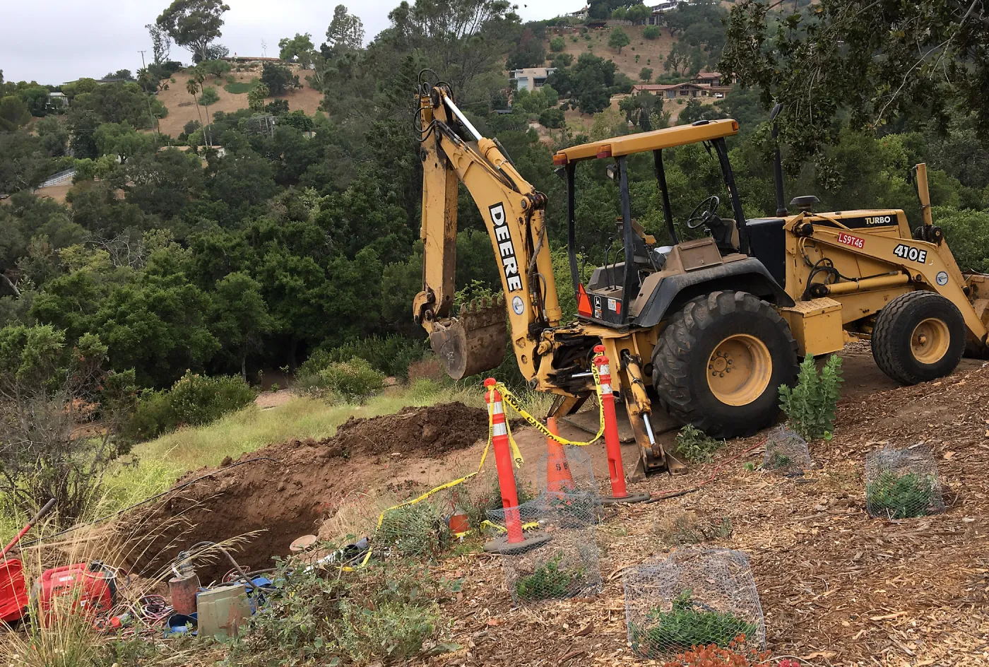 Fixing leaking water line on west PCC slope