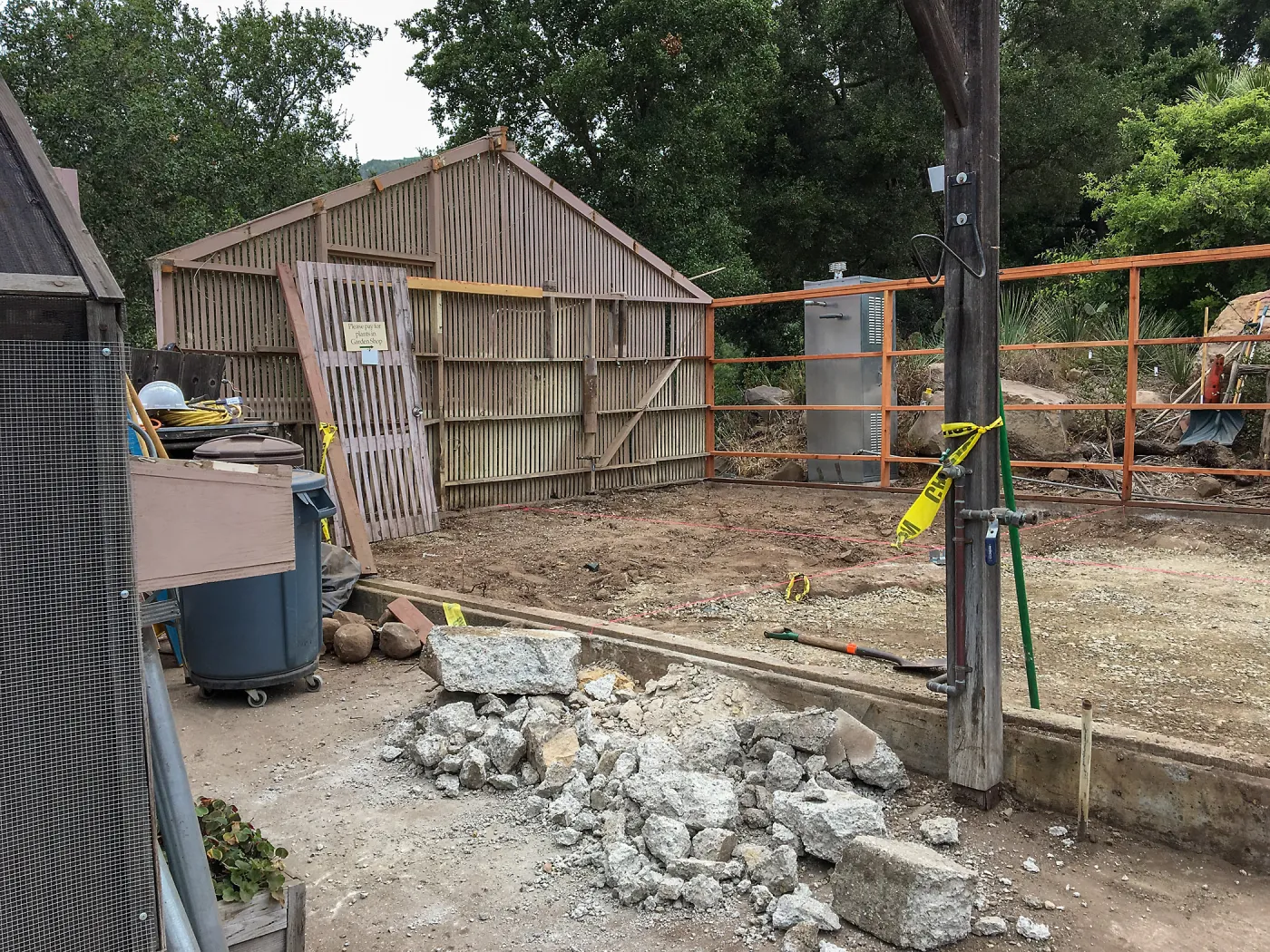 Repair of Garden Growers Lath House. Removing concrete step, looking towards northwest corner