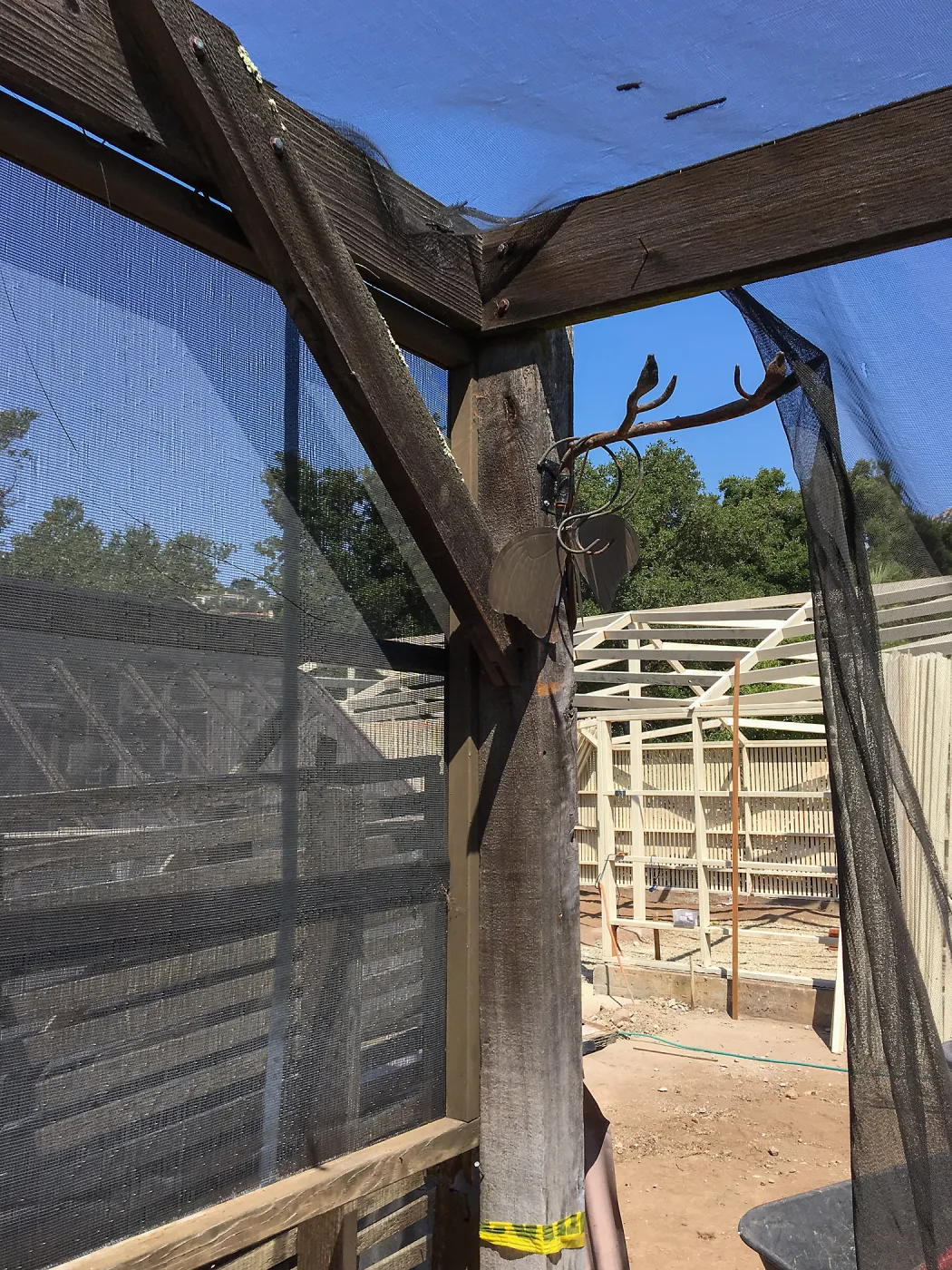 Repair of Garden Growers shade structure looking northwest