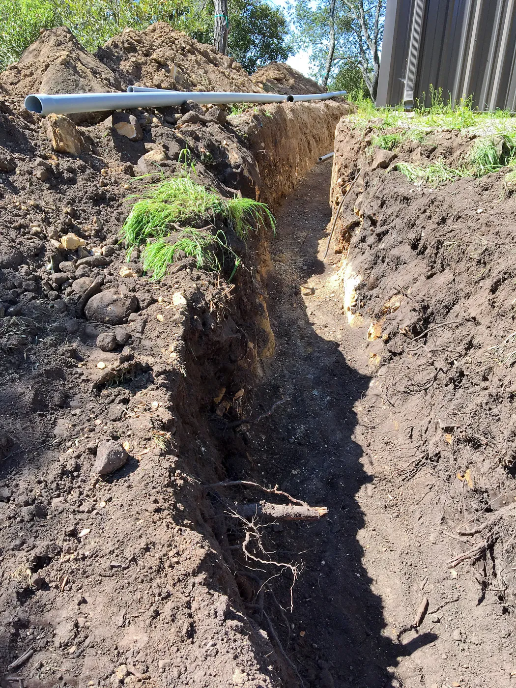 Trenching at Hansen site for communications and electrical lines