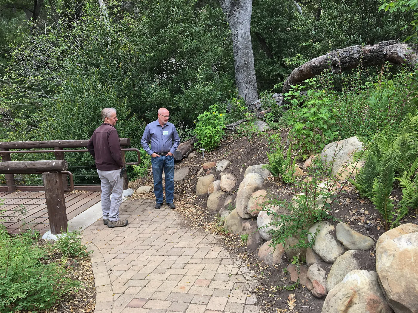 Dave Kershaw & Steve Windhager examine rock wall to be rebuilt at Campbell Bridge