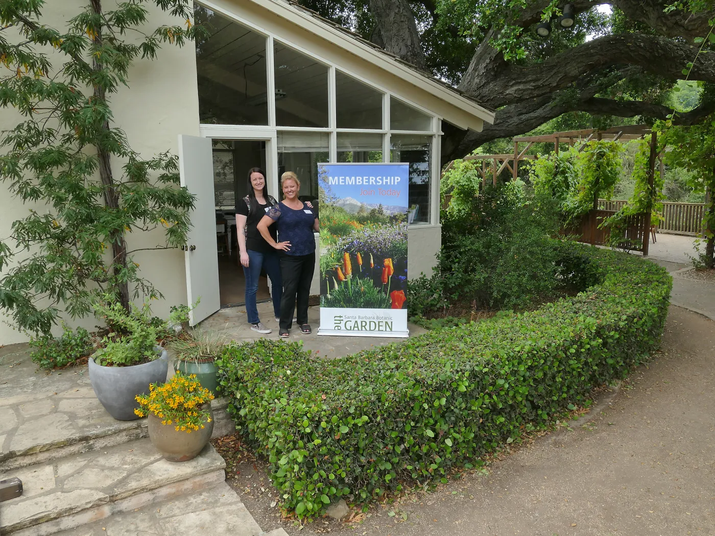 Rita Boss and Stacy Bloodworth with a new membership display banner