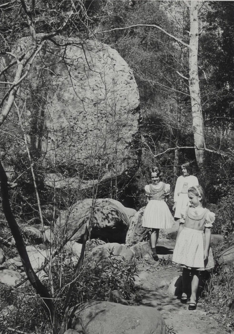 Girls in dresses walking in the Garden