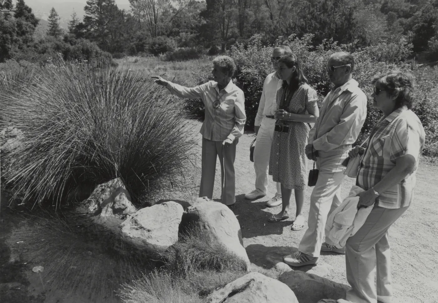 Docent Dorothea Fox leads a tour of the Garden
