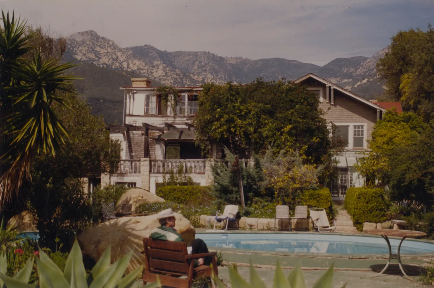 Clif sitting by pool at Gane House, Santa Barbara Botanic Garden