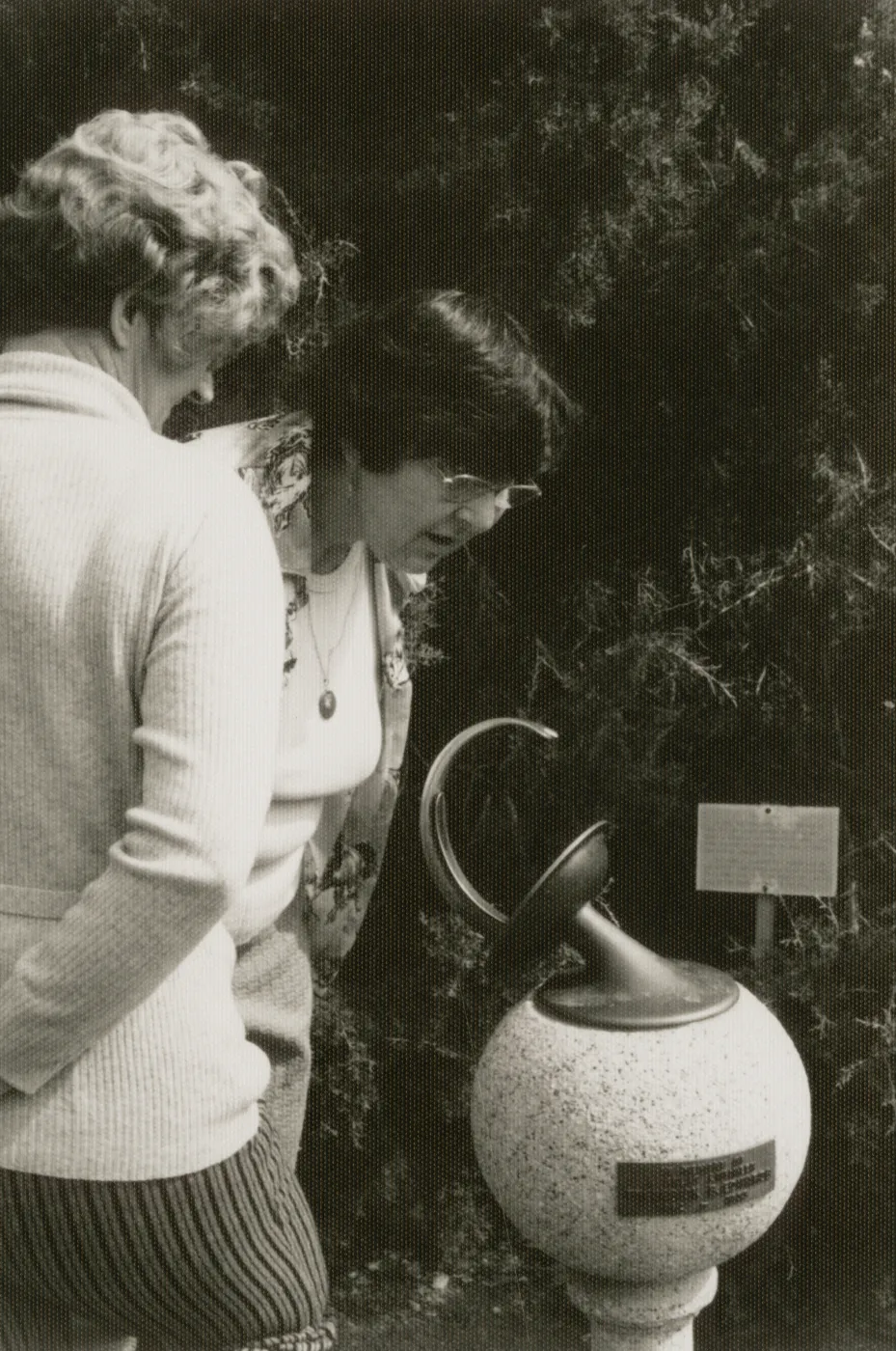 visitors examine the Sundial