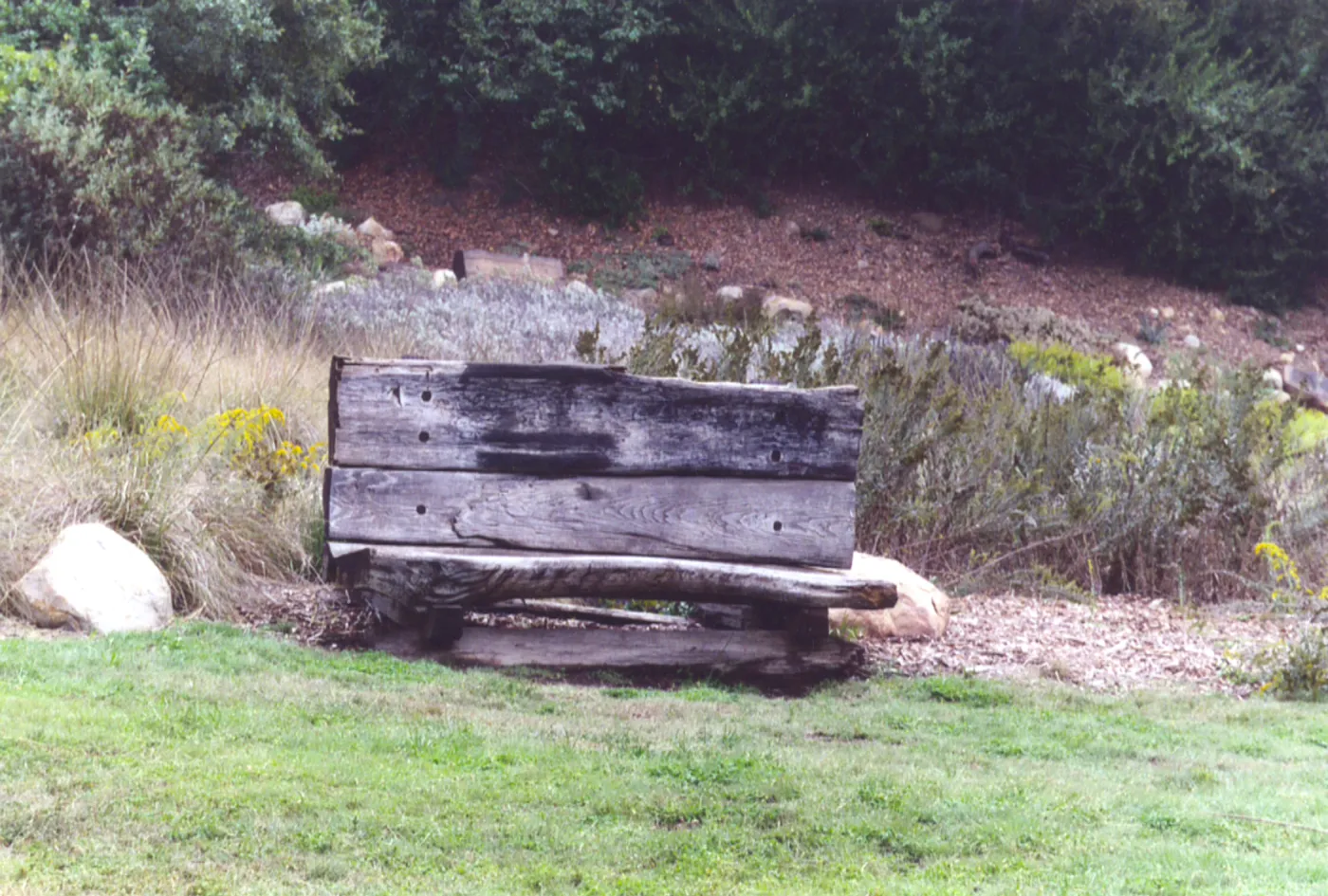 old wood bench (formerly placed in front of Blaksley Boulder)